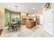 Bright kitchen with breakfast nook, center island, stainless steel appliances and tile floor at 4094 Sw 51St Ct, Ocala, FL 34474