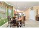 Bright kitchen with breakfast nook and tile flooring. The table has four chairs at 4094 Sw 51St Ct, Ocala, FL 34474