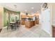 Bright kitchen with breakfast nook, center island, stainless steel appliances and tile floor at 4094 Sw 51St Ct, Ocala, FL 34474