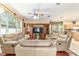 Bright living room with hardwood floors, comfortable seating and a built-in entertainment center at 4094 Sw 51St Ct, Ocala, FL 34474