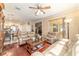 Open-concept living room with view into the kitchen, featuring hardwood floors and comfortable seating at 4094 Sw 51St Ct, Ocala, FL 34474