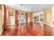 Bright living room with hardwood floors, natural light, and a seamless transition to dining and other living spaces at 4094 Sw 51St Ct, Ocala, FL 34474