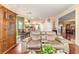 Open concept living room and kitchen with hardwood floors, seating and a dinette at 4094 Sw 51St Ct, Ocala, FL 34474