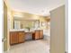 Main bathroom featuring double sinks, a soaking tub, and a walk-in shower at 4094 Sw 51St Ct, Ocala, FL 34474