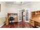 Spacious home office featuring hardwood floors and a view of the home at 4094 Sw 51St Ct, Ocala, FL 34474