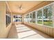 Bright sunroom with neutral colors, tile flooring, and exterior view at 4094 Sw 51St Ct, Ocala, FL 34474