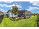 Beautifully landscaped backyard with a screened-in lanai, garden, and well-maintained lawn at 4340 Nw 56Th Ct, Ocala, FL 34482