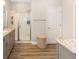 Well-lit bathroom features double vanities, granite countertops, and a glass-enclosed shower at 4340 Nw 56Th Ct, Ocala, FL 34482