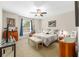 Comfortable bedroom features a queen-size bed, ceiling fan, and neutral decor, offering a relaxing retreat at 4340 Nw 56Th Ct, Ocala, FL 34482