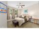 Inviting bedroom features a comfortable bed, soft lighting, and views of the outside greenery at 4340 Nw 56Th Ct, Ocala, FL 34482