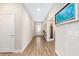 Bright foyer with tile floors, artwork, and an open doorway leading to additional rooms at 4340 Nw 56Th Ct, Ocala, FL 34482