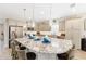 Modern kitchen featuring granite countertops, pendant lighting, stainless appliances, and seating at 4340 Nw 56Th Ct, Ocala, FL 34482
