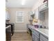Efficient laundry room featuring modern washer and dryer, ample counter space, and storage cabinets at 4340 Nw 56Th Ct, Ocala, FL 34482