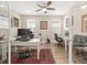 Bright home office featuring dual workstations, comfortable seating, and natural light at 4340 Nw 56Th Ct, Ocala, FL 34482