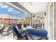 Covered outdoor patio with furniture, television, ceiling fan and views of the backyard at 4340 Nw 56Th Ct, Ocala, FL 34482
