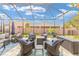 Covered outdoor patio with comfortable seating, a blue rug, and views of the backyard at 4340 Nw 56Th Ct, Ocala, FL 34482