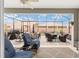 Relaxing screened lanai with comfortable seating, ceiling fan, and view of the backyard at 4340 Nw 56Th Ct, Ocala, FL 34482