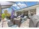 Expansive screened patio with stylish furniture and an open-air feel, perfect for outdoor entertaining at 4340 Nw 56Th Ct, Ocala, FL 34482