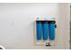 Water filtration system mounted to wall in the home's finished basement at 4416 Homan Loop, The Villages, FL 32163