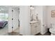 Bright half bathroom located adjacent to a bedroom at 4416 Homan Loop, The Villages, FL 32163