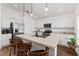 Modern kitchen featuring stainless steel appliances and an island with bar seating at 4416 Homan Loop, The Villages, FL 32163
