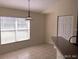 Comfortable dining area with tile flooring, abundant light, and a view to the yard at 4420 Sw 100Th St, Ocala, FL 34476
