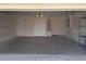 Spacious two car garage with neutral paint, lighting, and ample room for storage and parking at 4420 Sw 100Th St, Ocala, FL 34476