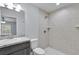 Bathroom featuring a single sink vanity and tiled shower at 4501 Sw 159Th Street Rd, Ocala, FL 34473