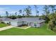 Charming single-story home featuring a well-manicured lawn, attached garage and a classic, neutral-toned exterior at 4501 Sw 159Th Street Rd, Ocala, FL 34473