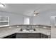View of double sink with countertop and grey cabinets at 4501 Sw 159Th Street Rd, Ocala, FL 34473