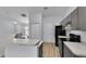 Modern kitchen features stainless steel appliances and a breakfast bar at 4501 Sw 159Th Street Rd, Ocala, FL 34473