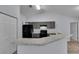 Modern kitchen with sleek countertops, stainless steel appliances, ample cabinet space and a pantry at 4501 Sw 159Th Street Rd, Ocala, FL 34473