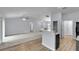 Bright, airy living space with views into the kitchen and multiple doorways at 4501 Sw 159Th Street Rd, Ocala, FL 34473
