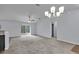 Well-lit living room showcasing an open layout with large sliding glass doors, and a modern ceiling fan at 4501 Sw 159Th Street Rd, Ocala, FL 34473