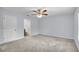 Spacious main bedroom with carpet and a ceiling fan at 4501 Sw 159Th Street Rd, Ocala, FL 34473