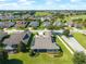A beautiful aerial view of a home with mature landscaping in a peaceful neighborhood at 5093 Nw 35Th Lane Rd, Ocala, FL 34482