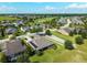An aerial shot of the house and neighborhood, showcasing the verdant landscaping and nearby golf course at 5093 Nw 35Th Lane Rd, Ocala, FL 34482