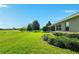 Expansive backyard featuring lush green lawn and meticulously maintained landscaping at 5093 Nw 35Th Lane Rd, Ocala, FL 34482