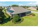 Enjoy this backyard view, featuring a screened-in lanai and well-maintained landscaping at 5093 Nw 35Th Lane Rd, Ocala, FL 34482