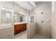 Bathroom view of glass enclosed shower, double vanity sinks and tile surround at 5093 Nw 35Th Lane Rd, Ocala, FL 34482