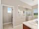 Bright bathroom with large glass shower, neutral tile and a separate water closet at 5093 Nw 35Th Lane Rd, Ocala, FL 34482