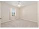 This is a bedroom with carpeted floors, neutral walls, and a window for natural light at 5093 Nw 35Th Lane Rd, Ocala, FL 34482