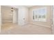 Bedroom with plantation shutters, neutral walls, and carpeted floors at 5093 Nw 35Th Lane Rd, Ocala, FL 34482