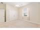 This bedroom has carpeted floors, neutral walls, a ceiling fan, a closet and a window at 5093 Nw 35Th Lane Rd, Ocala, FL 34482