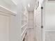 Well-organized walk-in closet with extensive shelving and racks for storage at 5093 Nw 35Th Lane Rd, Ocala, FL 34482