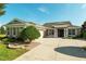 Beautiful home featuring manicured landscaping, well-kept lawn and an attached garage at 5093 Nw 35Th Lane Rd, Ocala, FL 34482