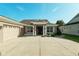 Well-maintained home featuring a front yard, and an attached two-car garage at 5093 Nw 35Th Lane Rd, Ocala, FL 34482