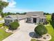 Well maintained home featuring manicured landscaping, a welcoming driveway and attached garage at 5093 Nw 35Th Lane Rd, Ocala, FL 34482