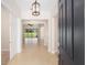 A welcoming foyer featuring an overhead light fixture and a view into the living space at 5093 Nw 35Th Lane Rd, Ocala, FL 34482