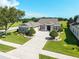 A well-maintained home featuring a circular driveway and manicured landscaping at 5093 Nw 35Th Lane Rd, Ocala, FL 34482